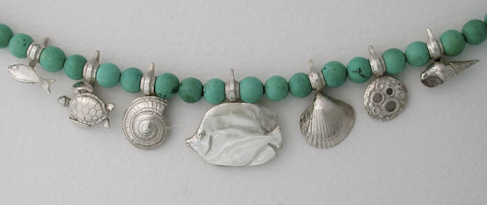 Silver choker on green Turquoise